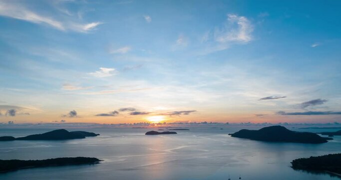 Aerial view Drone High angle view,Hyperlapse footage of sunrise sky over sea with reflection in the water surface at Phuket Thailand, Beautiful sunset or sunrise sky background,Timelapse sky clouds