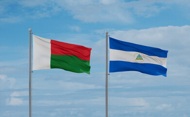 Nicaragua and Madagascar flags, country relationship concept