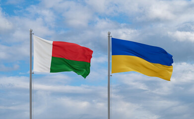 Ukraine and Madagascar flags, country relationship concept
