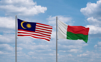 Madagascar and Malaysia flags, country relationship concept