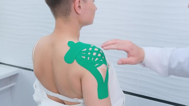 An orthopedic traumatologist examining a female patient to determine injury, pain, mobility and diagnose treatment in the shoulder, arm, elbow and wrist areas