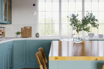 Kitchen with green cabinets, large window in the background and accent countertop to advertise the product. 