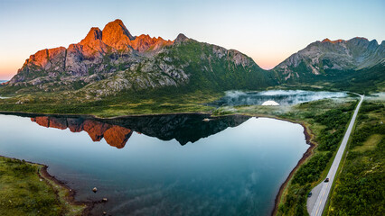 Aerial view of a road and mountain reflections in a lake, Svolvaer, Austvagoya, Lofoten, Nordland, Norway