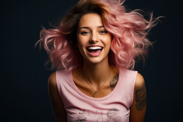Woman with pink hair and tattoos smiling at the camera.