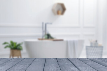 Empty grey wooden table in bathroom. Space for design