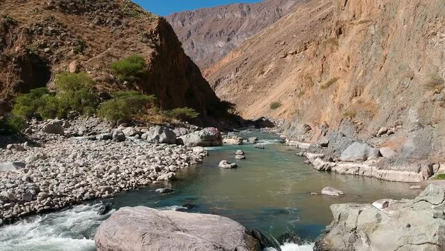 Drone flight over river in Colca Canyon Peru