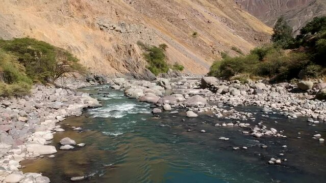 Drone flyover river in Colca Canyon Peru