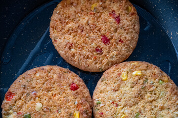 vegan burgers in teflon pan