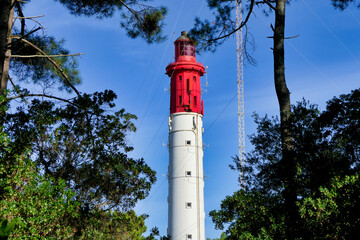 Cap Ferret Lighthouse, 57 metres high, set among maritime pines on a peninsula jutting out from...