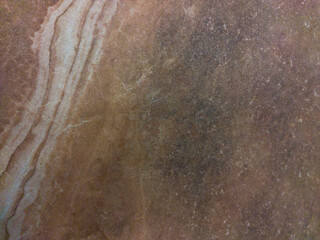 Glossy surface of brown shades with abstract patterns. Brown background with lines and patterns.