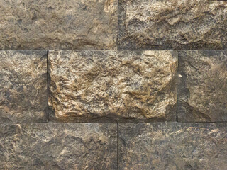 Gray brick wall. A large brick. Grey background with horizontal brickwork.