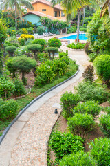 Pool at the promenade of Santa Maria with trees and walkingway