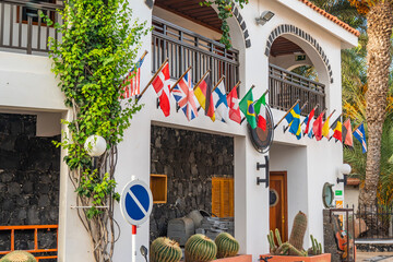 Flags of the Europeans countries in front of a Hotel building in Cape Verde