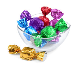Bowl with many tasty candies in colorful wrappers isolated on white