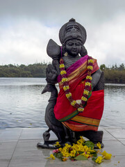Statue of Lord Muruga at Ganga Talao lake in Mauritius - obrazy, fototapety, plakaty