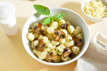 Potato gnocchi with mushroom, cheese and greens