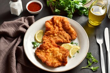 Schnitzel with lemon and leaves of parsley