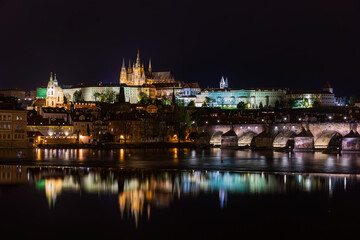 Illuminated night view of the charles bridge and Hradcin castle in Prague, Czech Republic