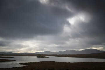 An autumnal HDR NC500 image of dark foreboding clouds over Clar-loch Mor in Sutherland, northern...