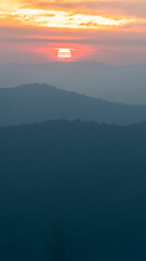 Colorful sunset on top of Thailand mountain