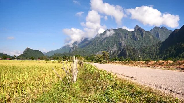 Rice fields and views of Vang Vieng city, Laos, video clip for Laos tourism.