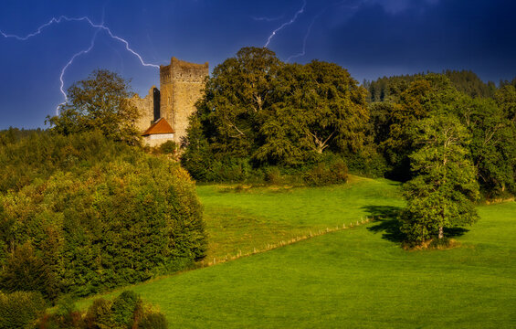 Medieval ruin of Sulzberg castle in a thunderstorm