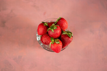 fresh strawberries fruit in a bowl with background