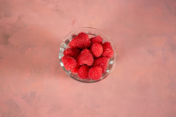 fresh raspberry fruit in a bowl with background