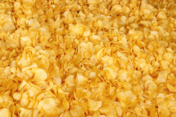 Fresh Crispy potato chips snack texture background, top view