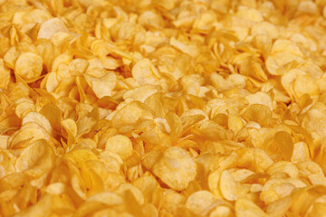 Fresh Crispy potato chips snack texture background, top view