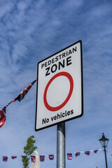 Pedestrian zone no vehicle sign with blue cloudy sky background. Information and transport concept illustration.