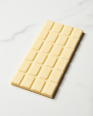 White chocolate bar on white marble background. 