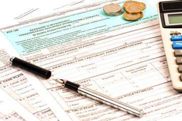 Fototapeta premium Polish tax documents with pen and coins 