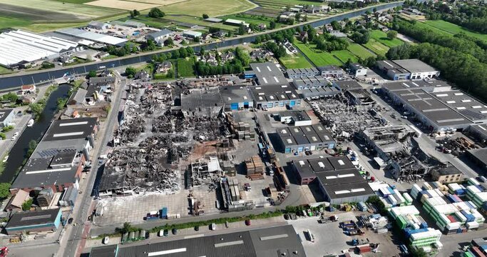 Aerial drone view of the aftermath of a large fire in Ter Aar on an industrial complex.