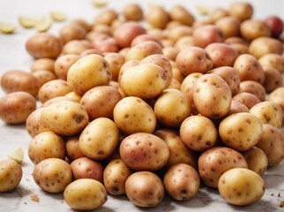 Pile of potatos on plain white background