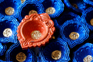 Traditional Colorful Diwali diya or clay lamp for sale at Pune, India market in Diwali festival.