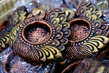 Traditional Colorful Diwali diya or clay lamp for sale at Pune, India market in Diwali festival.