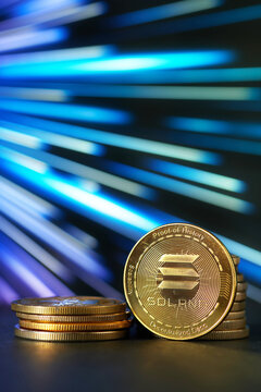 Closeup of Golden Solana cryptocurrency vertically with abstract background over cyberspace
