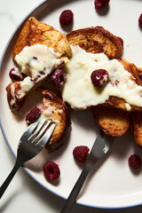 Coffee French toast. French toasts with coffee aroma and condensed milk serve with mascarpone cream and raspberries