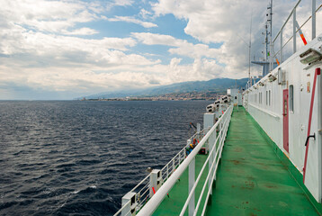 The deck of a ferry boat sailing across the strait of Messina