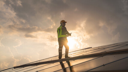 Techniques checking solar cell on the roof for maintenance. Service engineer worker install solar panel. Clean energy concept..