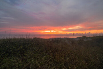 sunrise over beach dunes