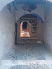 A quiet journey through a narrow lane between pretty houses