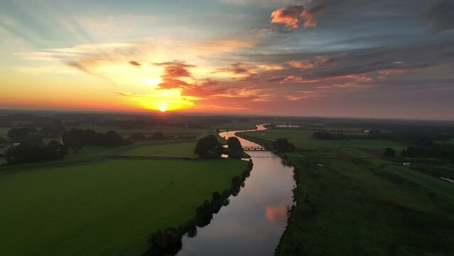 Sunrise over the Vecht river seen from above during a beautiful fall morning in Overijssel, The Netherlands.