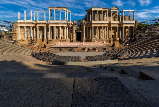 Complete view from below of the floor of the Roman Theater of Mérida with the scaffolding, spotlights, stage and chairs placed under the stands prepared for International Classical Theater Festival