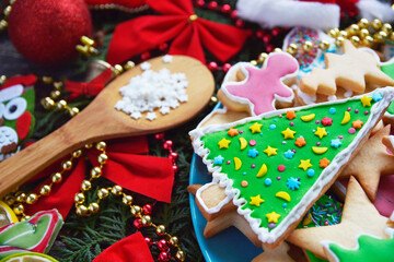 holiday Gingerbread Cookies christmas tree shape around garland lights. Merry Christmas and Happy New Year card	