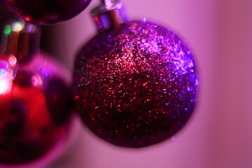 Purple christmas baubles, shiny glittery decorations, magical lights.