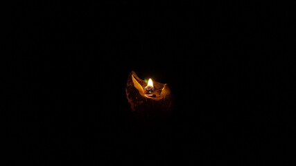 single candle with dark background