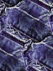 Blue jeans destroyed and torn with a seamless patchwork pattern.
Denim fabric for youth best for background and fashion wallpaper. 