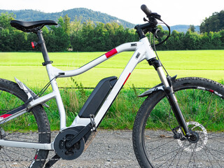 Fototapeta na wymiar Electric bike against the background of a mountain road